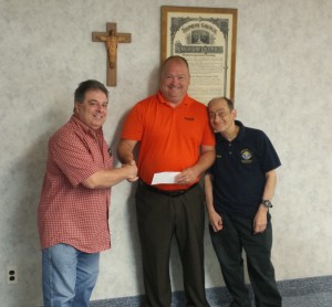 (l to r) Joe Ozoniak, GK; presents check to  Scott Milliken, Executive Director of DPD and Anthony Iovino